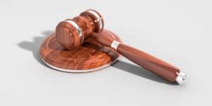 A wooden gavel on a white background.