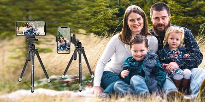 A family is posing for a photo on a tripod.