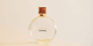 A bottle of chanel perfume on a table.